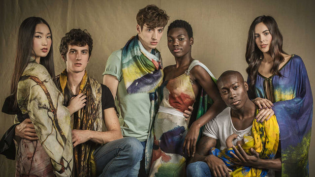 Group of models wearing Vestilarte art scarves and kaftans